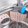 H5b17ec13729a4f18a40070e8f19dada3U.webp Kitchen Sink Holder Hanging Drain Basket Adjustable Soap Sponge Shelf Organizer Bathroom Faucet Holder Rack Kitchen Accessories